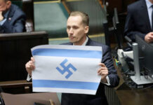 “Israel es un nuevo Tercer Reich”, dice diputado polaco mostrando una bandera israelí con una esvástica "Israel es un nuevo Tercer Reich", dice diputado polaco mostrando una bandera israelí con una esvástica